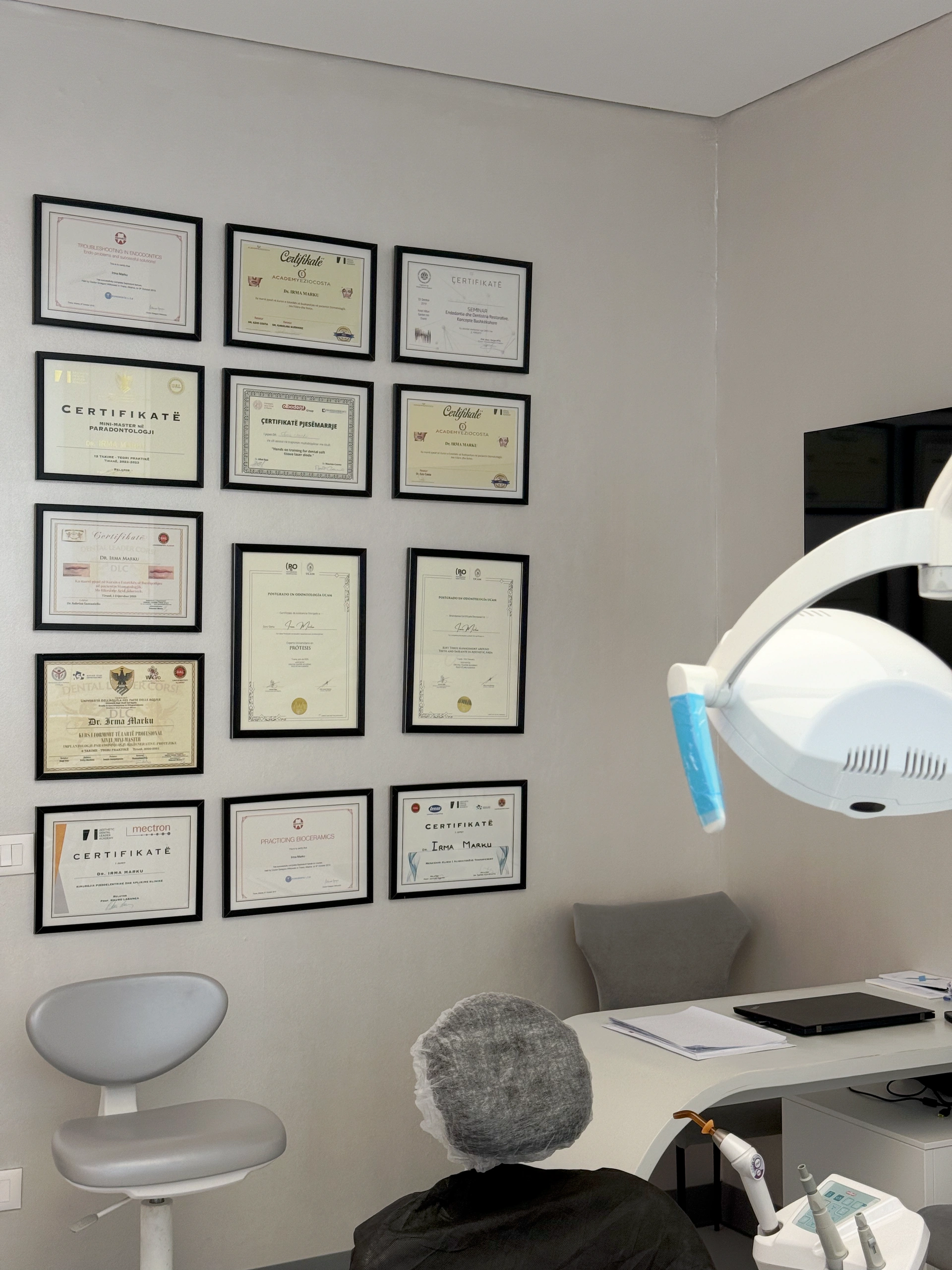 Surgery at Dental Oasis Tirana with framed certificates