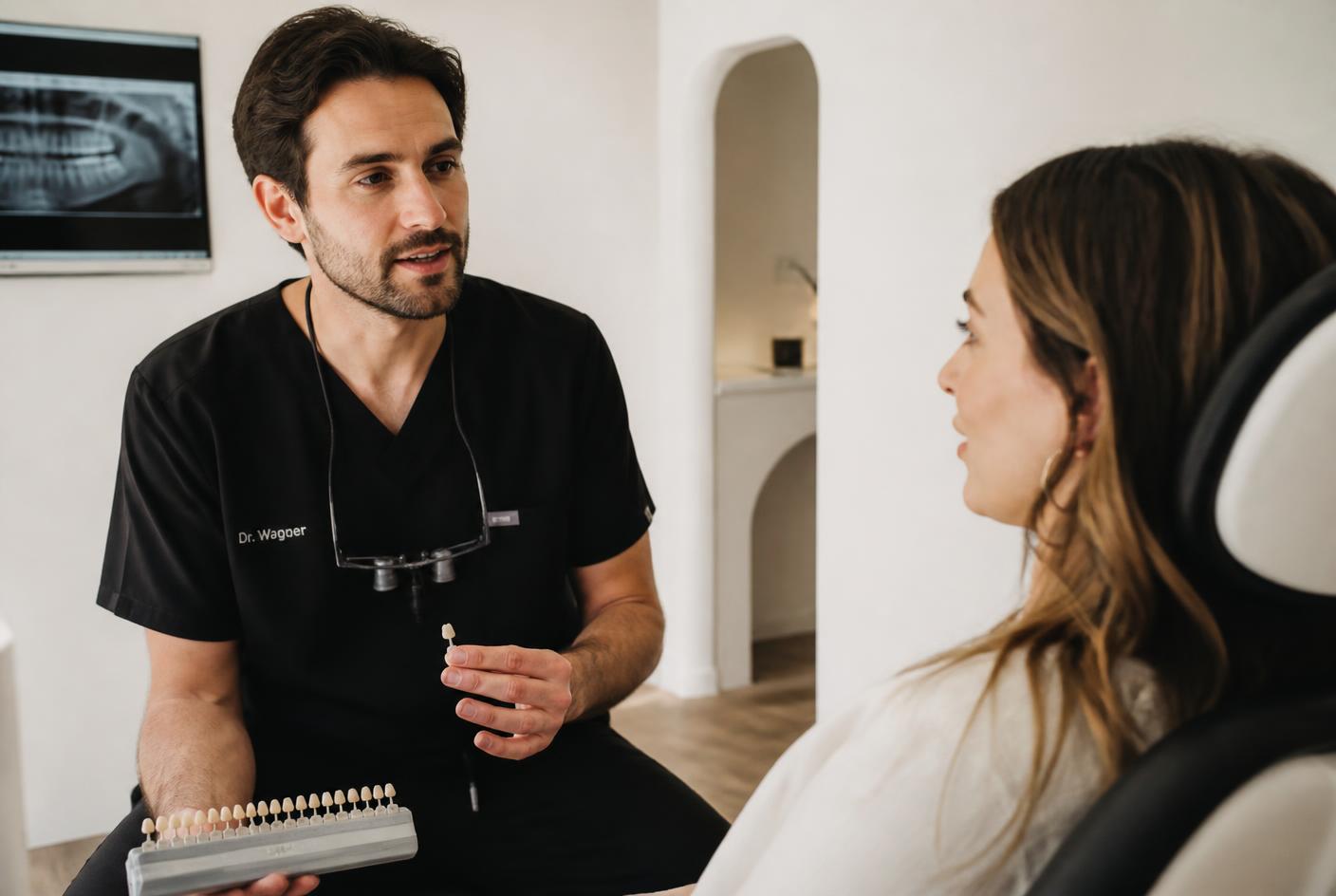 Dentist agreeing a composite shade with a patient before bonding