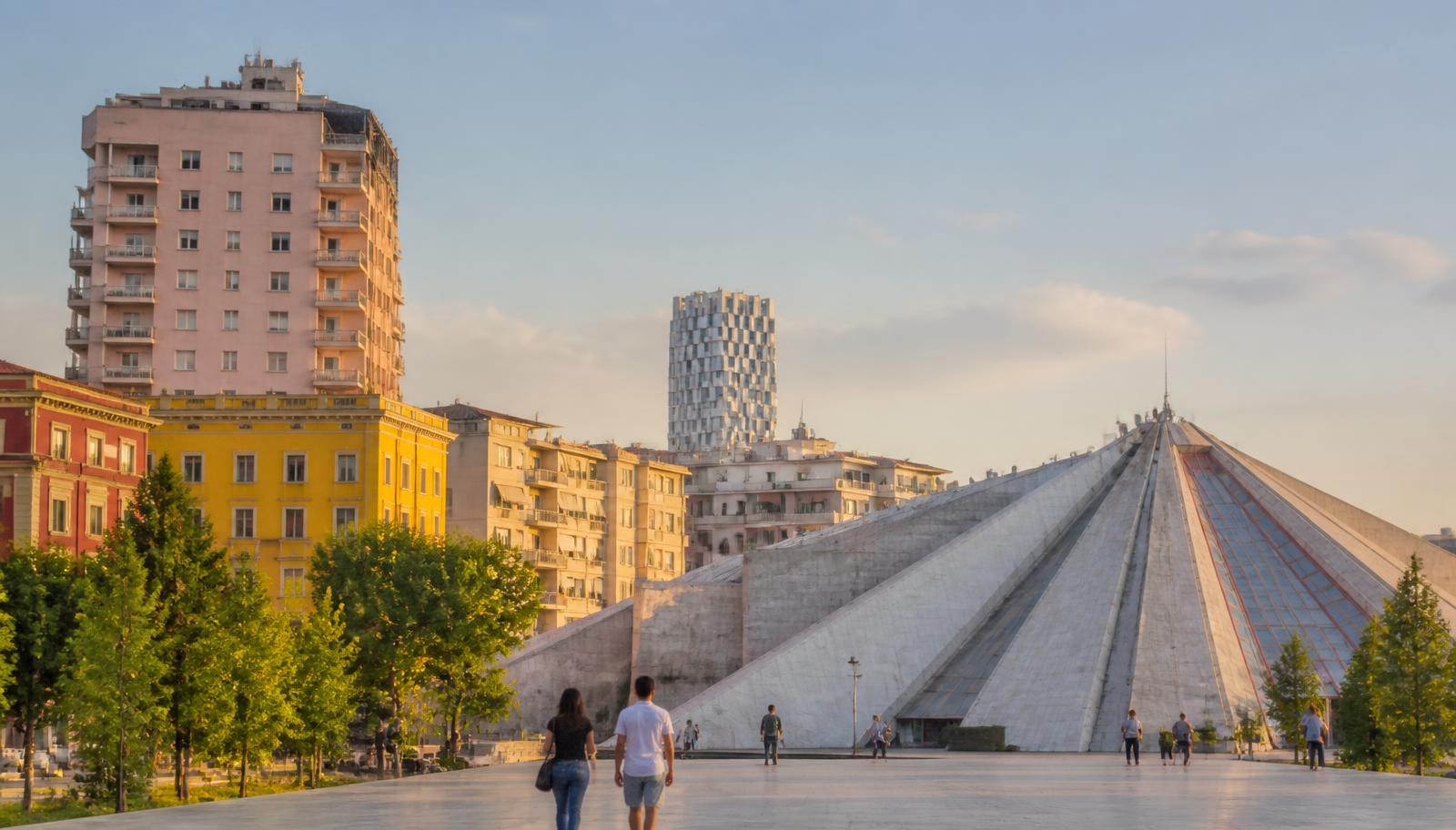 Central Tirana, Albania in late afternoon light, with the Pyramid of Tirana and pastel city buildings